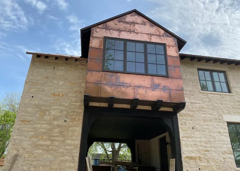 Copper metal panel facade on a stone building for Roof Repair in Lower Macungie